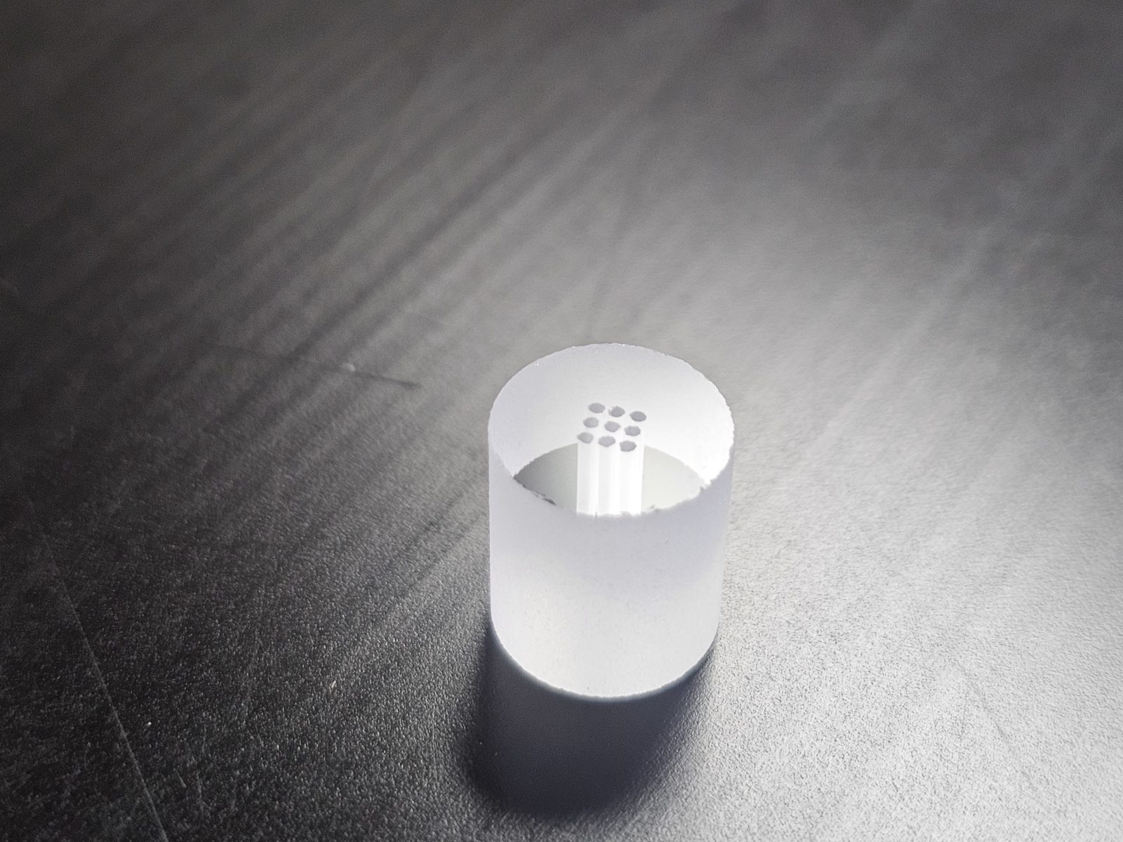 Micro-hole array in a thick-walled glass cylinder — laser-drilled