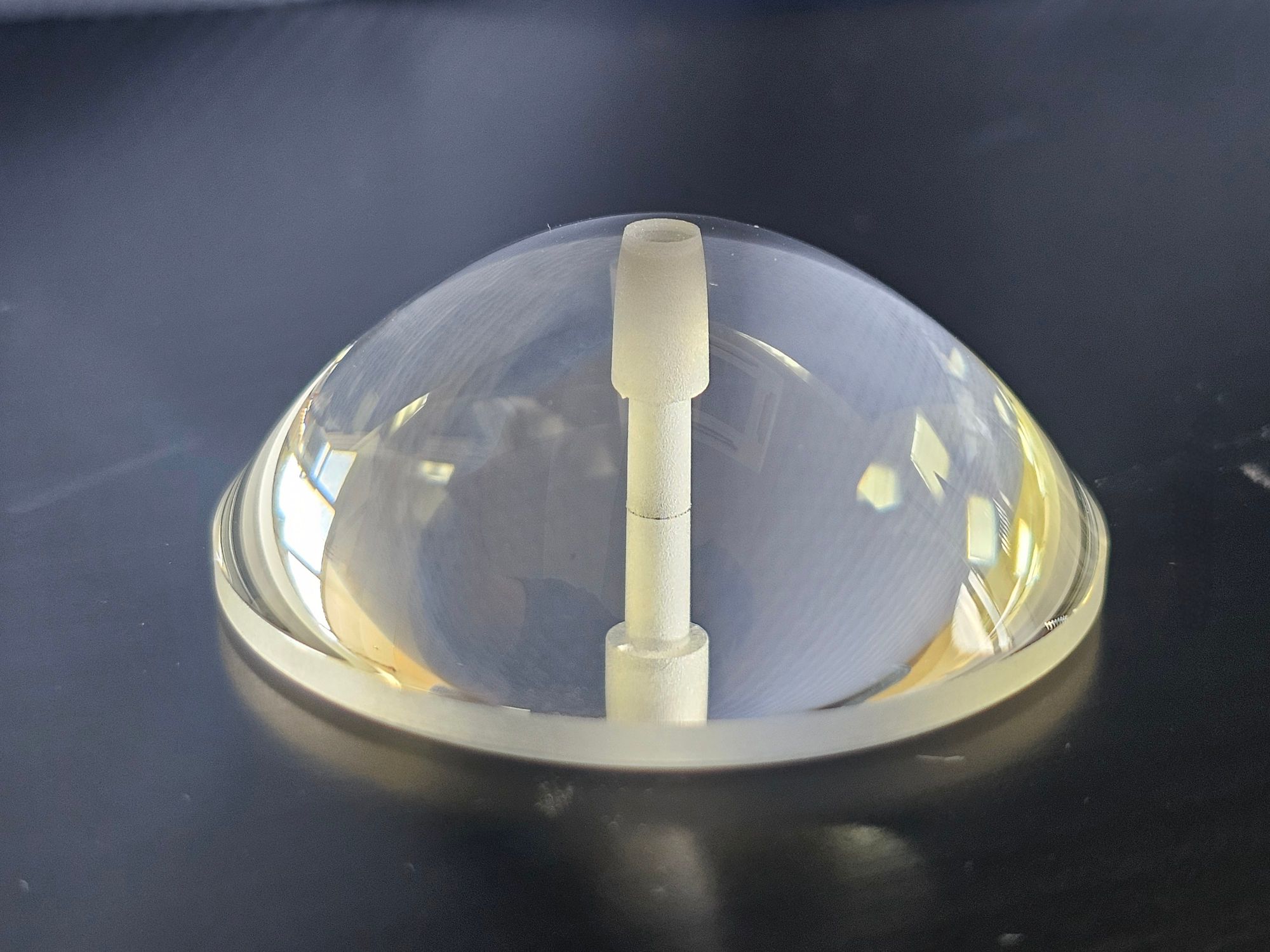Stepped bore in an optical glass dome &mdash; laser-drilled without micro-cracks
